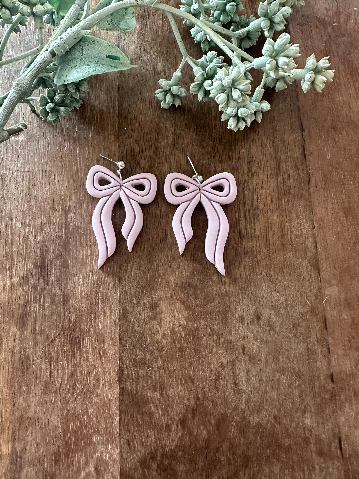 Purple bow dangles