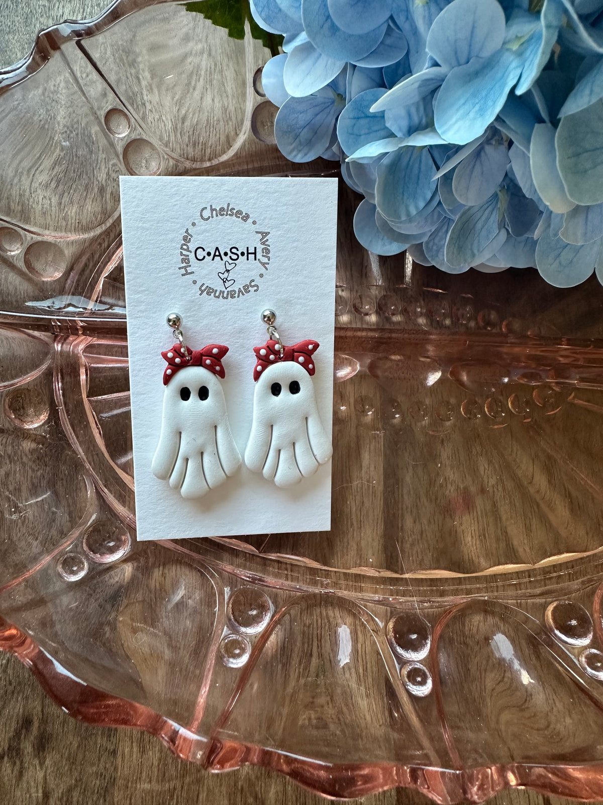 Ghost with red bow dangles