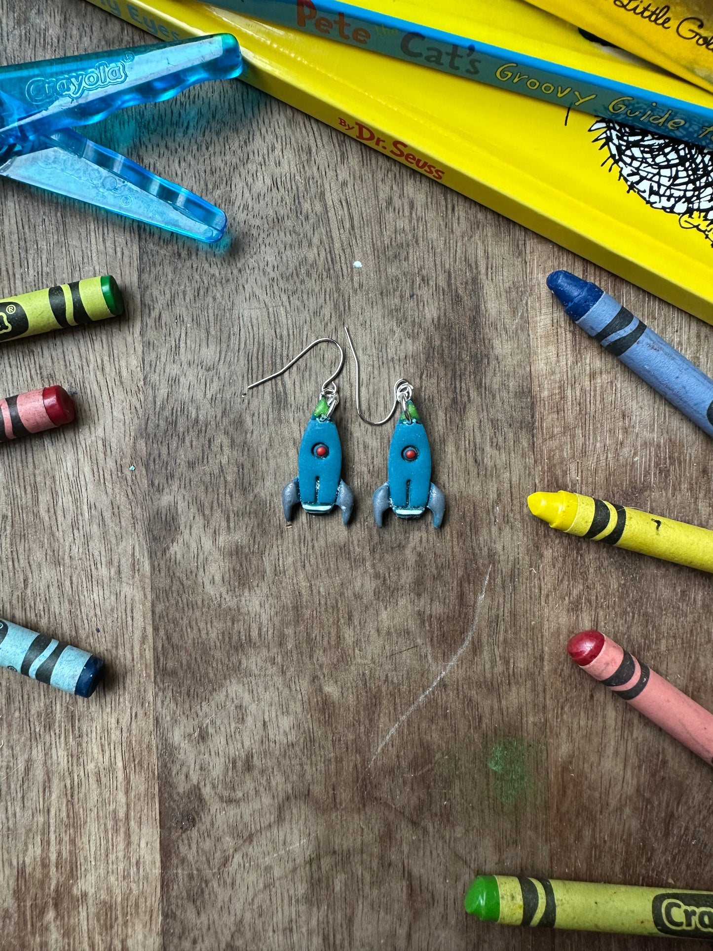 Blue rocket ship dangles