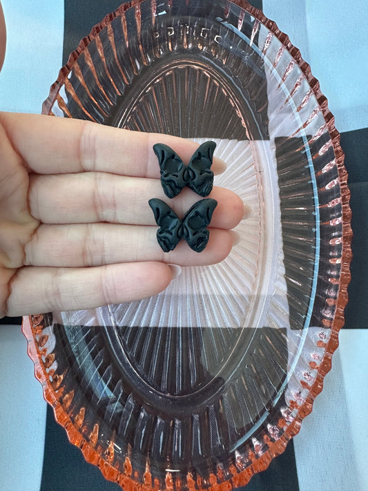Black skull butterfly stud