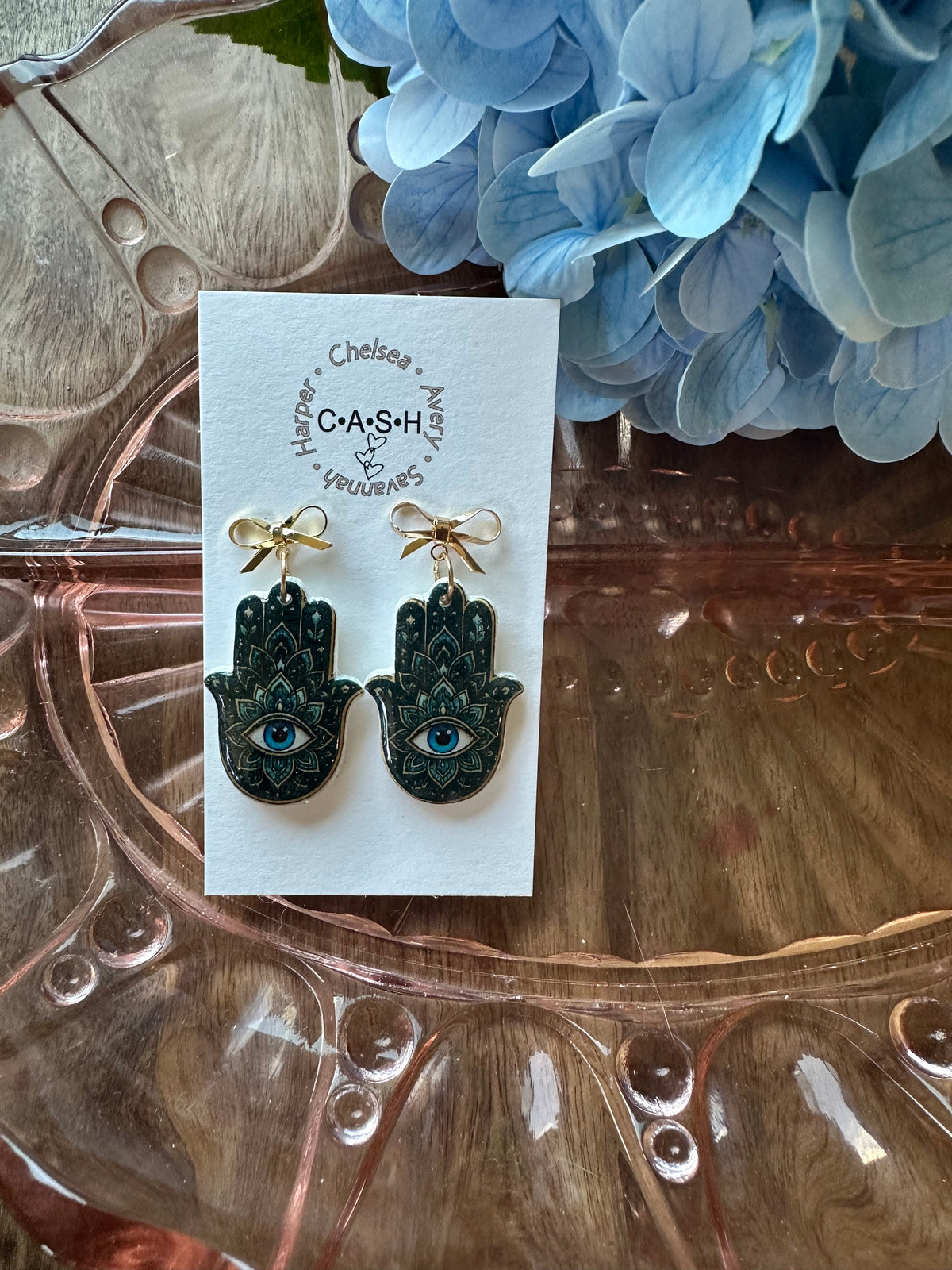 Green evil eye with gold bow dangles