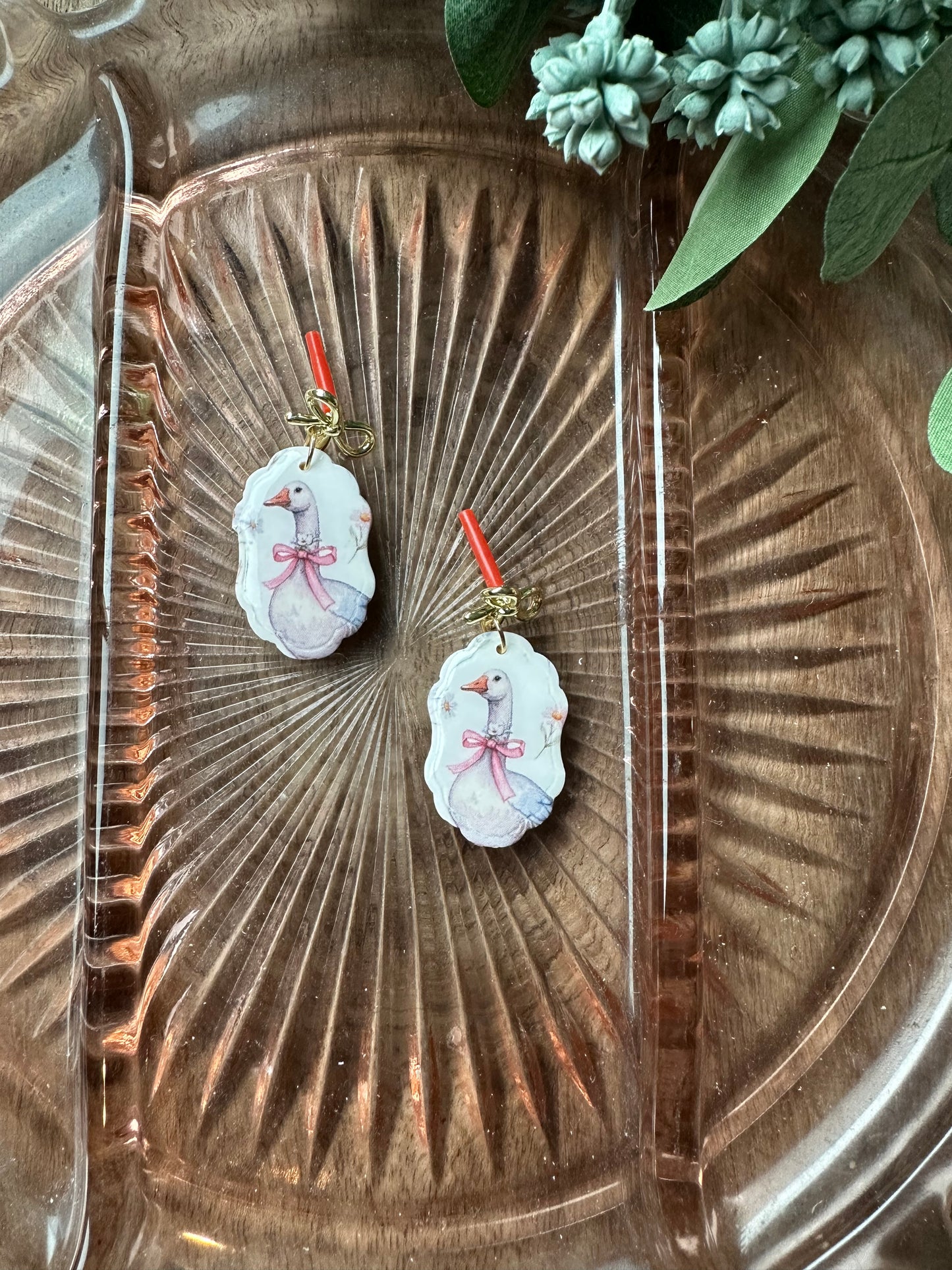 Goose dangles with bows