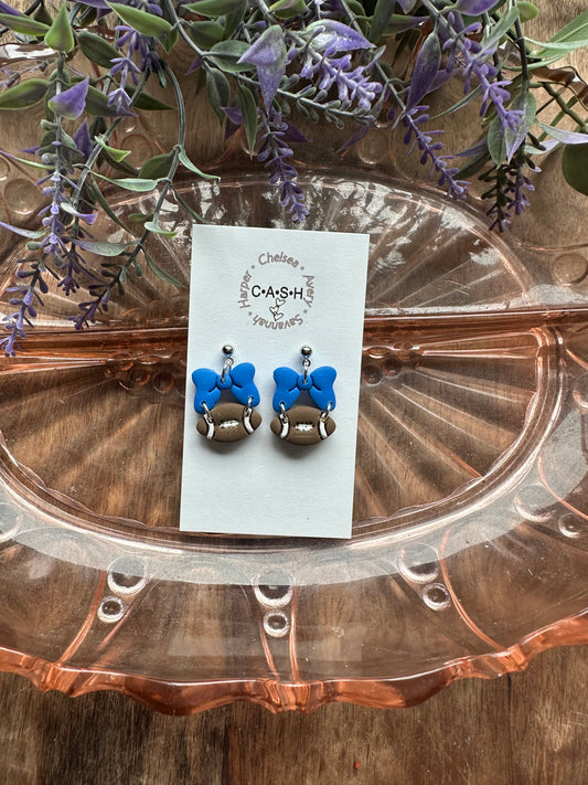 Football with blue bow dangles