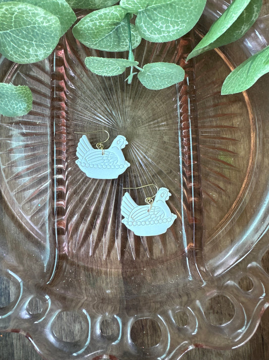 White hen dangles