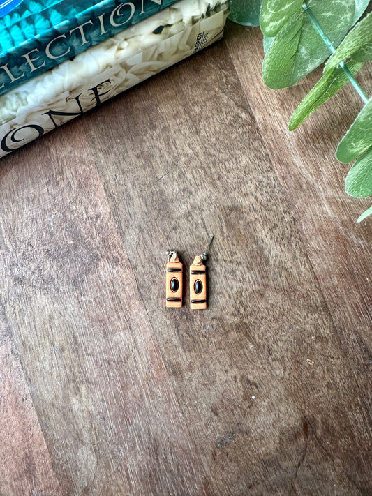 Small orange crayon ￼earrings