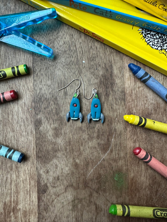 Blue rocket ship dangles