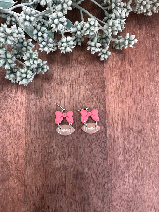 Pink bow football dangles