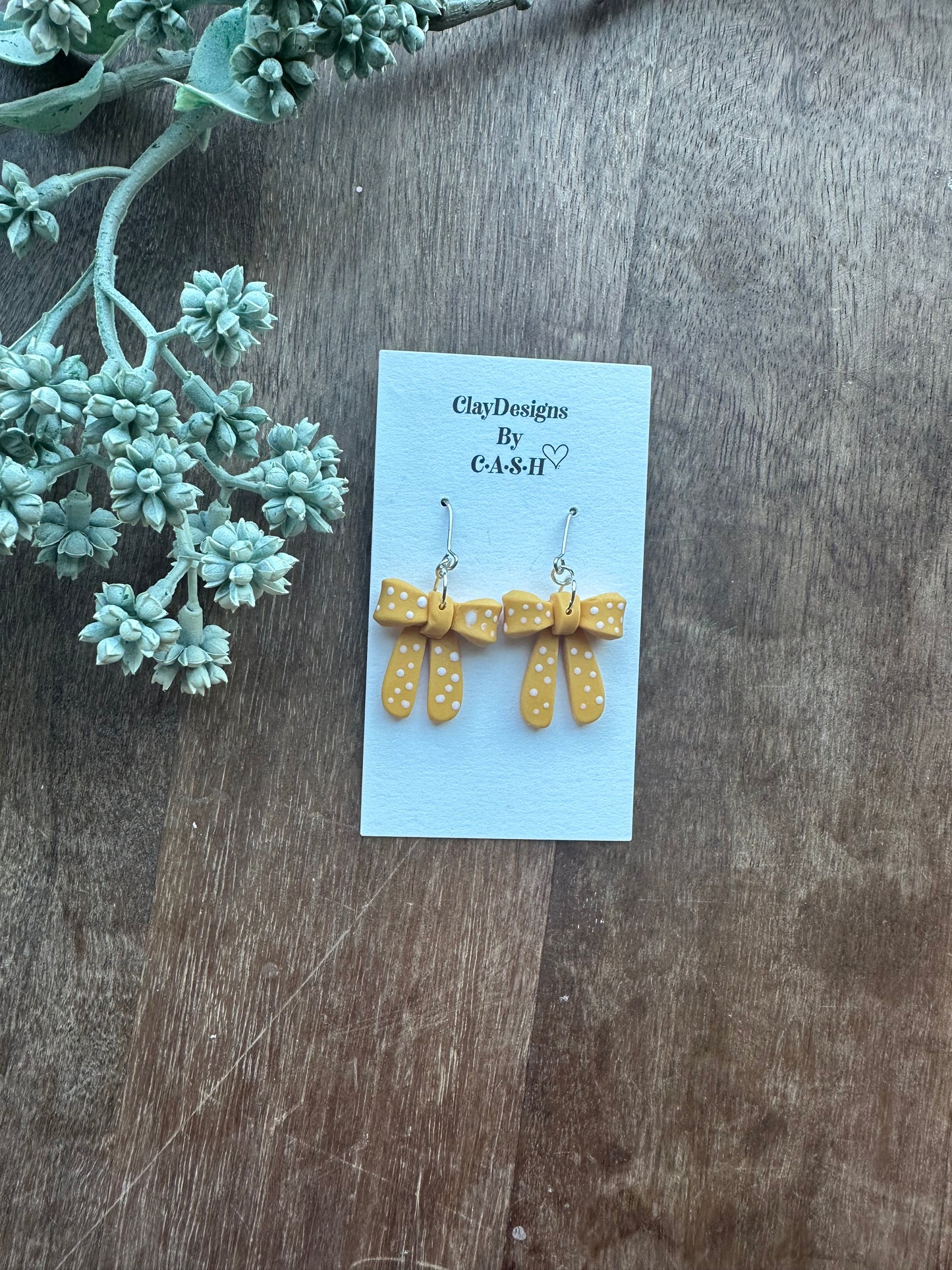 Yellow polka dot bow dangles